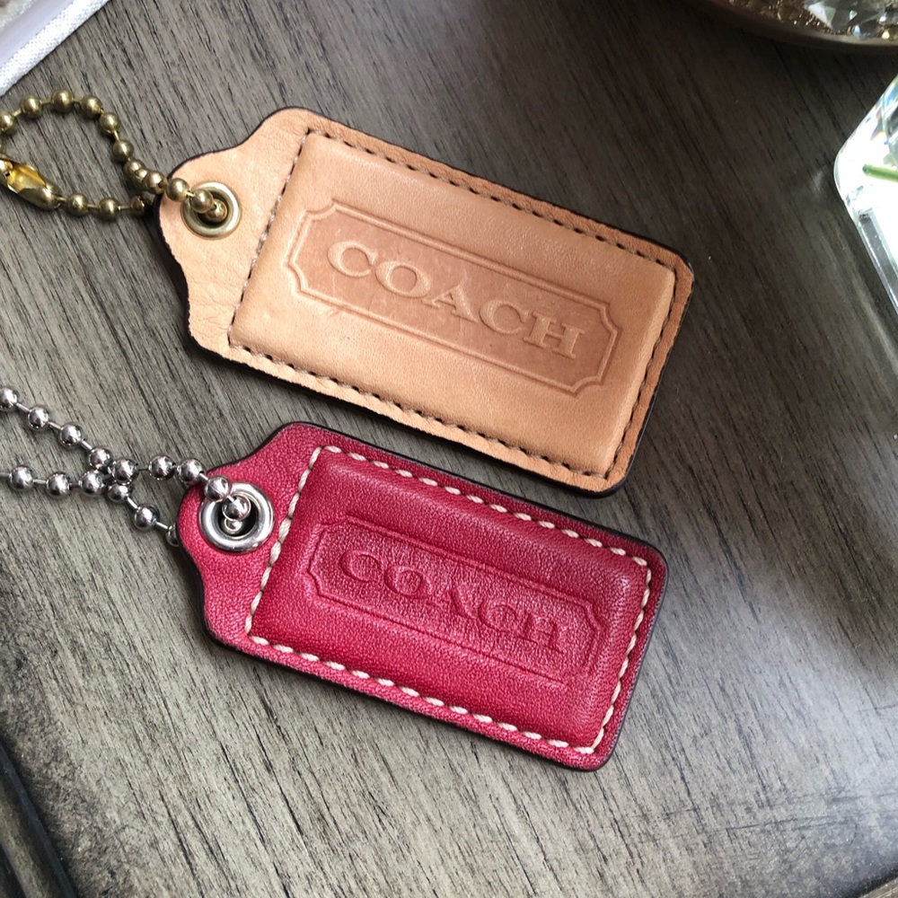 Two leather coach keychains